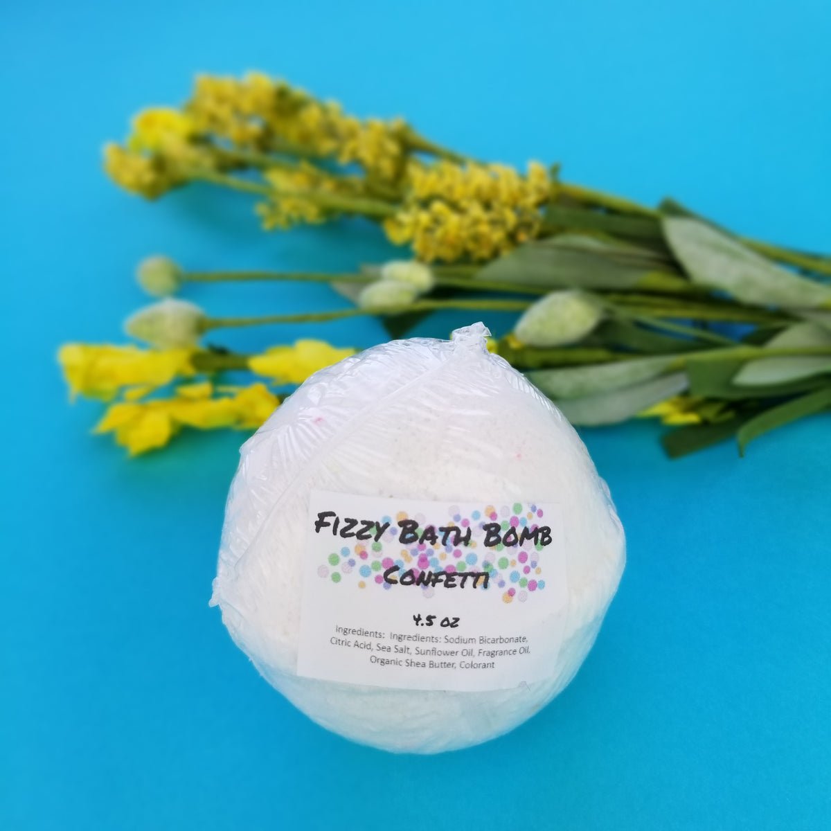 Fizzy Bath Bomb with added Confetti! 4.5 OZ with ingredients: Sodium Bicarbonate, Citric Acid, Sea Salt, Sunflower Oil, Fragrance Oil, Organic Shea Butter, Colorant